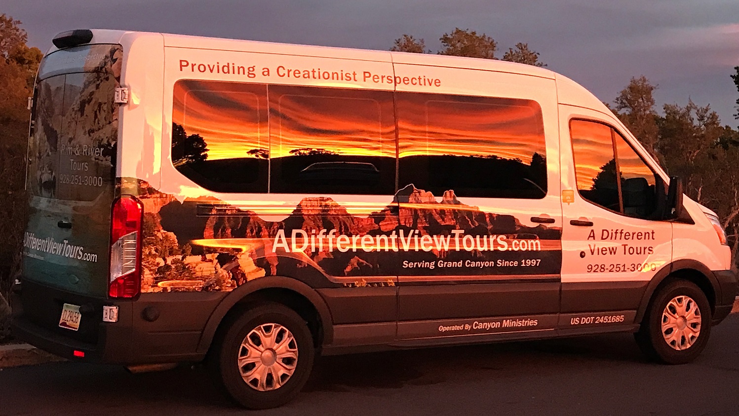Canyon Ministries tour van at Grand Canyon sunset