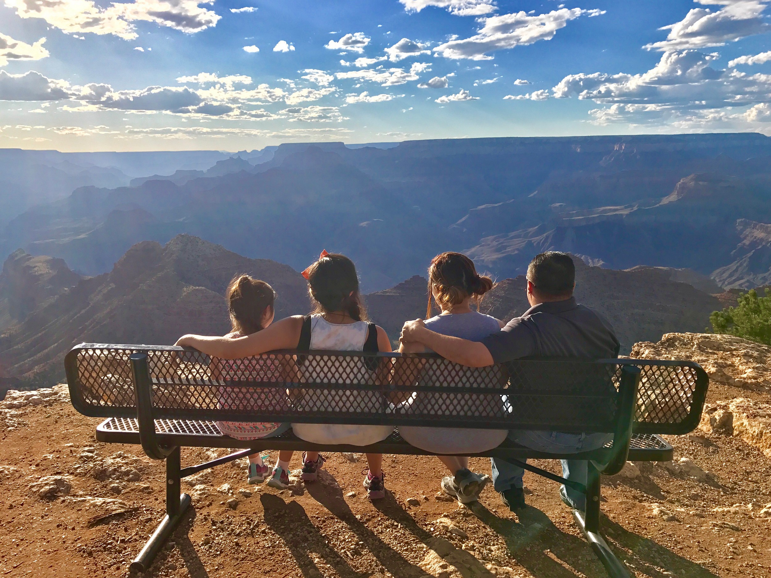 Family on a bench at Desert View Grand Canyon